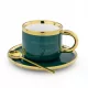  Eine Tasse mit Untertasse und einem Löffel für Mrs. Magister eprezenty