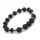  Rosenkranz-Armband an der Hand, Vulkanstein