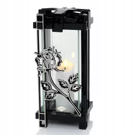    Eine moderne, elegante Kerze mit einer dekorativen schwarzen und silbernen Rosenblüte